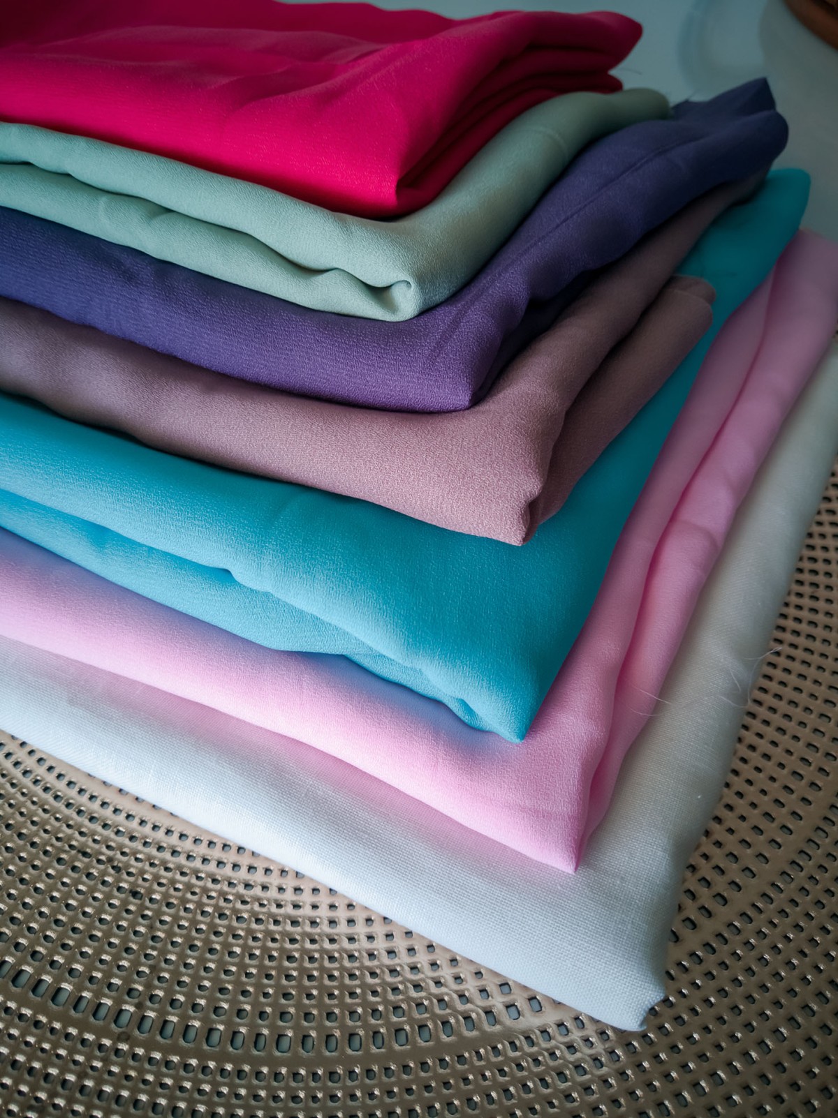 stack-of-colorful-fabric-textile-2023-11-27-05-21-48-utc.jpg