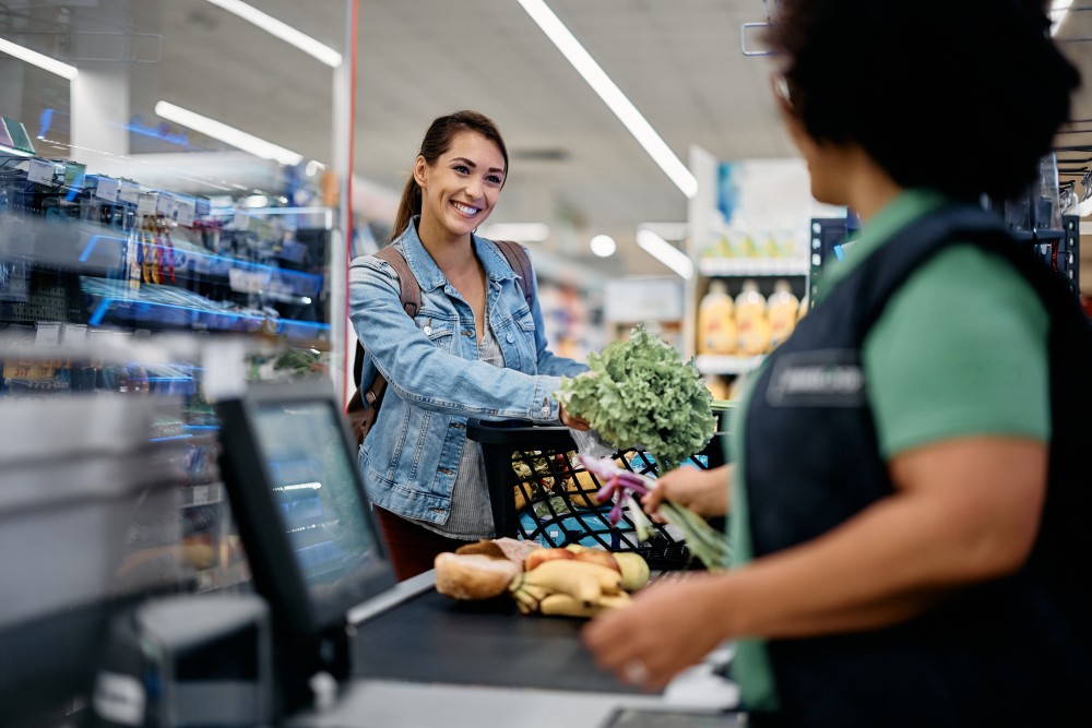 young-happy-woman-at-supermarket-checkout-2023-11-27-05-00-06-utc.jpg