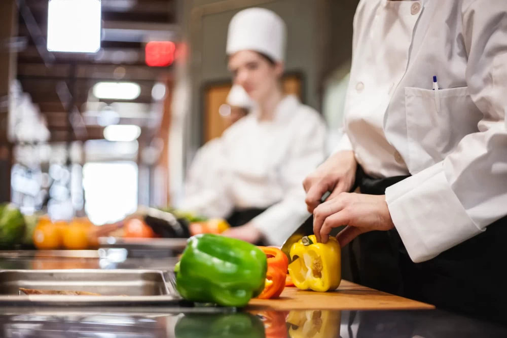 a-closeup-of-the-hands-of-a-chef-cutting-vegetable-2022-03-04-02-34-39-utc.webp