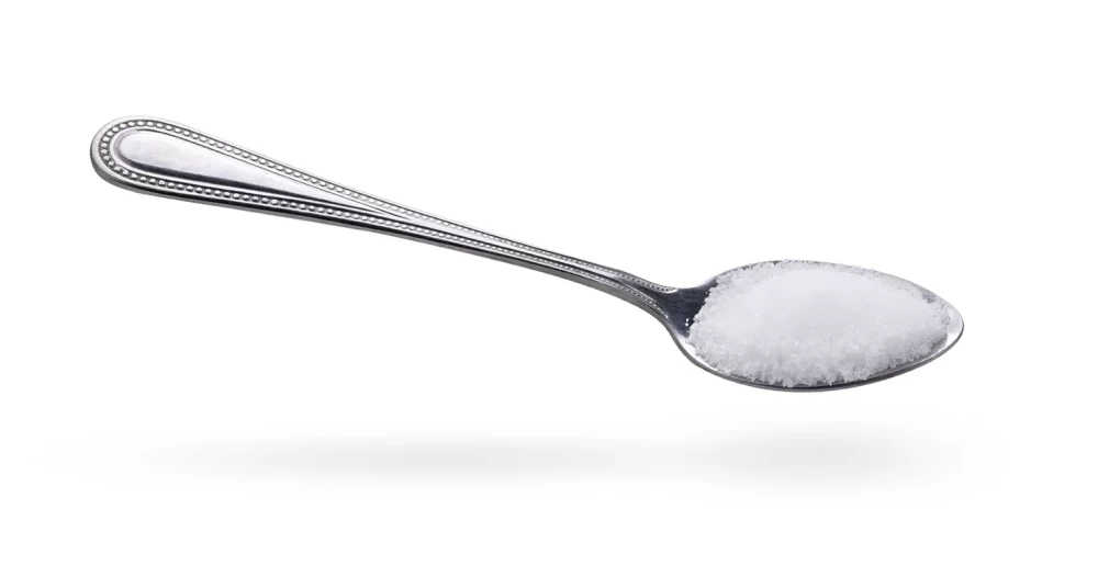 salt-in-stainless-steel-spoon-on-white-background.webp
